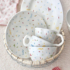 Set of irregular ceramic dinner plates and bowls